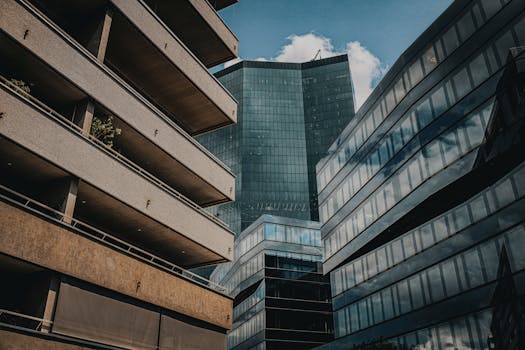 Low-angle view of modern skyscrapers in Zürich, showcasing urban architecture.